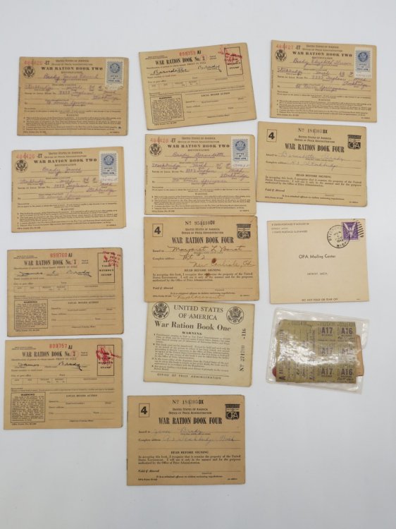 1942 WWII WAR RATION LEATHER POUCH, 13 RATION BOOKS, STAMPS, AND RED & BLUE POINT TOKENS