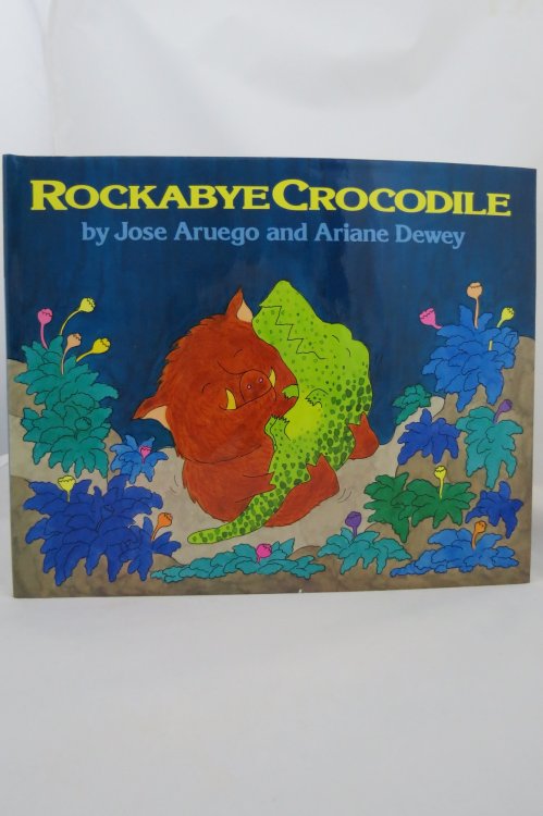 ROCKABYE CROCODILE (DJ is protected by a clear, acid-free mylar cover) (Signed by Illustrator)