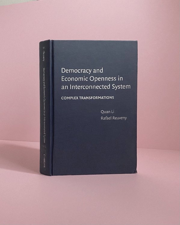Democracy and Economic Openness in an Interconnected System: Complex Transformations