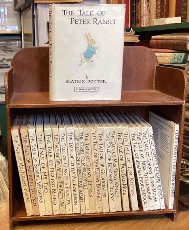 Peter Rabbit's Book Shelf. Complete set of 23 titles of Beatrix Potter in a wooden bookcase