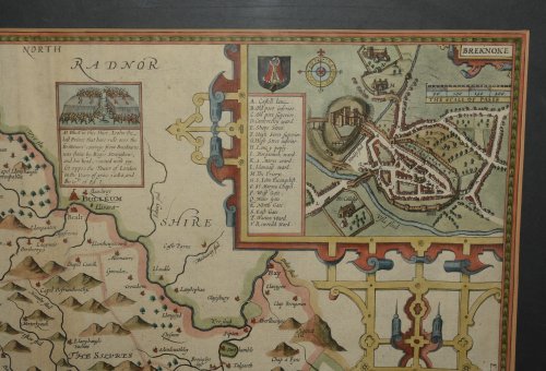 AN ORIGINAL ENGRAVED MAP OF BREKNOKE (both shire and town) Brecknockshire An attractive and decorative map with inset town plan of Breknoke, scales of English Miles, and 3 elaborate coat of arms. Title cartouche Engraved by Hondius.