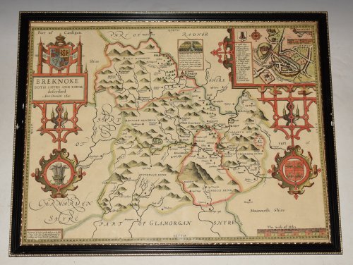 AN ORIGINAL ENGRAVED MAP OF BREKNOKE (both shire and town) Brecknockshire An attractive and decorative map with inset town plan of Breknoke, scales of English Miles, and 3 elaborate coat of arms. Title cartouche Engraved by Hondius.