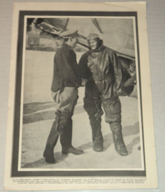 A vintage magazine photographic illustration of the IRISH AVIATOR PIONEER JAMES FITZMAURICE, who flew on the first East to West Trans-Atlantic flight, shaking the hand of American aviator FLOYD BENNETT, Byrd's pilot during his expedition to the North Pole who also flew the relief mission to the Brem