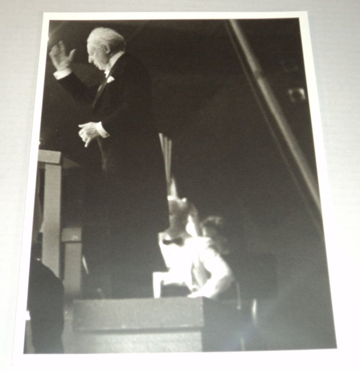 A HANDSOME BLACK & WHITE PORTRAIT OF THE GREAT CONDUCTOR LEOPOLD STOKOWSKI conducting from a podium at the EMPIRE STATE MUSIC FESTIVAL in ELLENVILLE, NEW YORK.