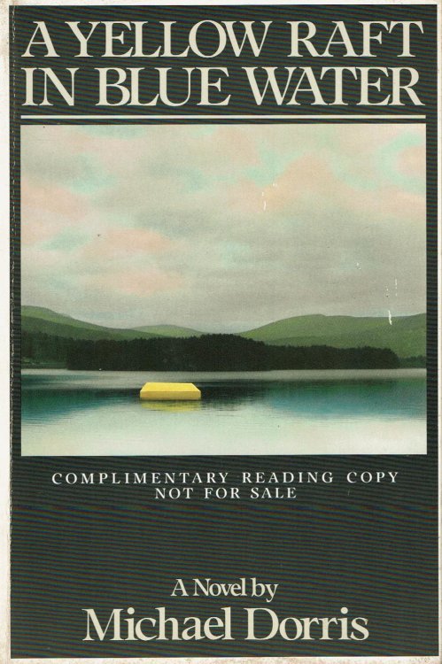 A YELLOW RAFT IN BLUE WATER.