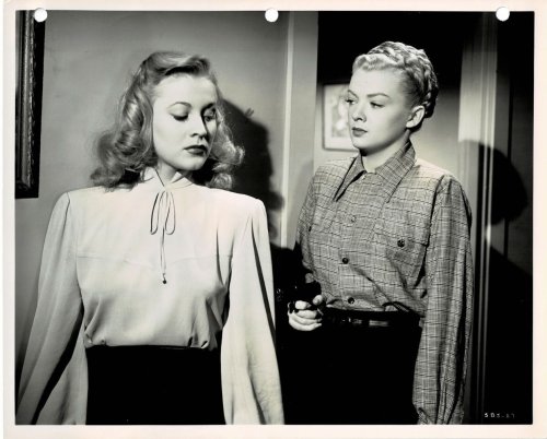 A VINTAGE PUBLICITY PHOTOGRAPH of Hollywood Actress ANNE JEFFREYS & MYRNA DELL in a scene from RKO's espionage thriller 