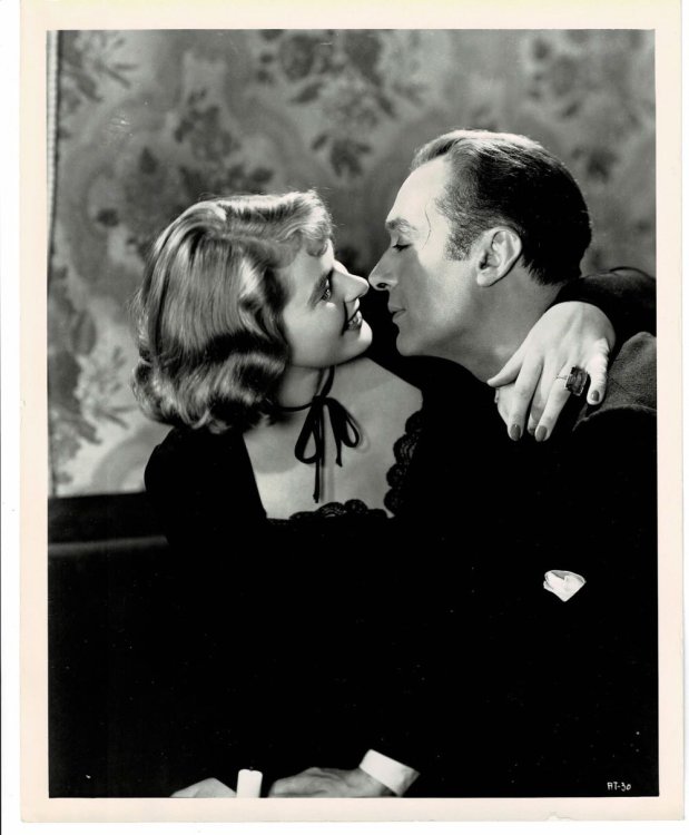 A VINTAGE PUBLICITY PHOTOGRAPH of Hollywood Movie Stars INGRID BERGMAN and CHARLES BOYER in a scene from 