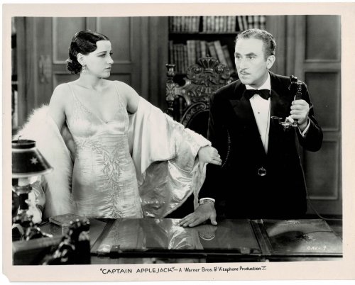 A VINTAGE PUBLICITY PHOTOGRAPH of Hollywood Actress KAY STROZZI & Actor JOHN HALLIDAY on the set of Warner Bros. 