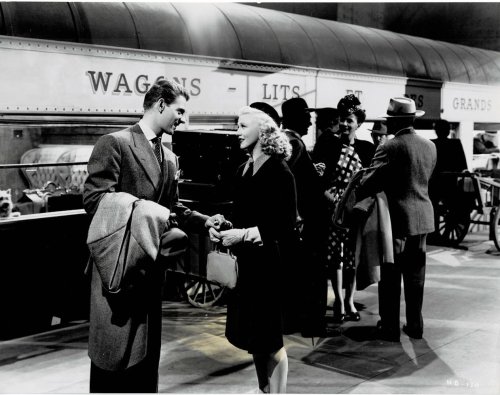 A VINTAGE CONTINUITY LAYOUT PHOTOGRAPH depicting GINGER ROGERS and JEAN-PIERRE AUMONT at the train station in a scene from 