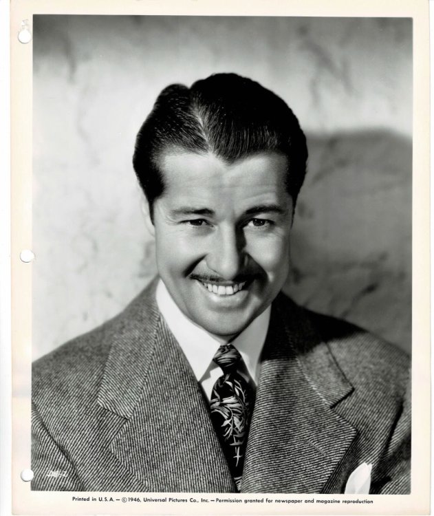 A VINTAGE BLACK & WHITE PRESS PHOTOGRAPH of the Hollywood Movie actor DON AMECHE, who stars in 