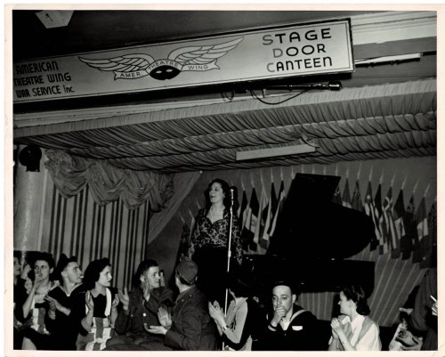 ORIGINAL PHOTOGRAPH by ARTHUR C. MACAULAY of the Spanish Pianist AMPARO ITURBI accepting the applause of the audience at the American Theatre Wing War Service's 