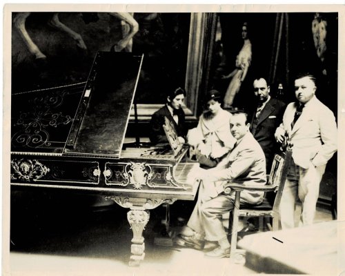 ORIGINAL PHOTOGRAPH of the Virtuoso Pianist JOSE ITURBI seated at a piano in Mexico, with producer & manager JEAN DALRYMPLE and three others in the background.