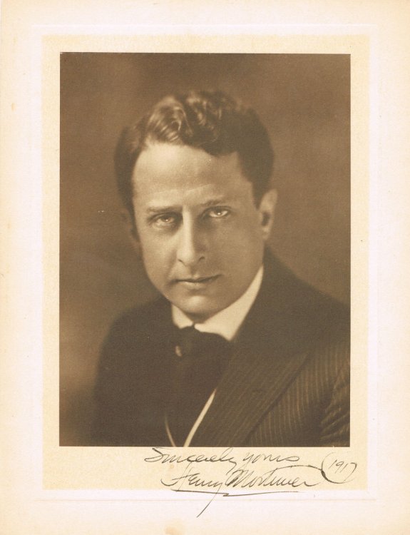 AN ORIGINAL SIENNA-TONED PHOTOGRAVURE PORTRAIT SIGNED BY HENRY MORTIMER.