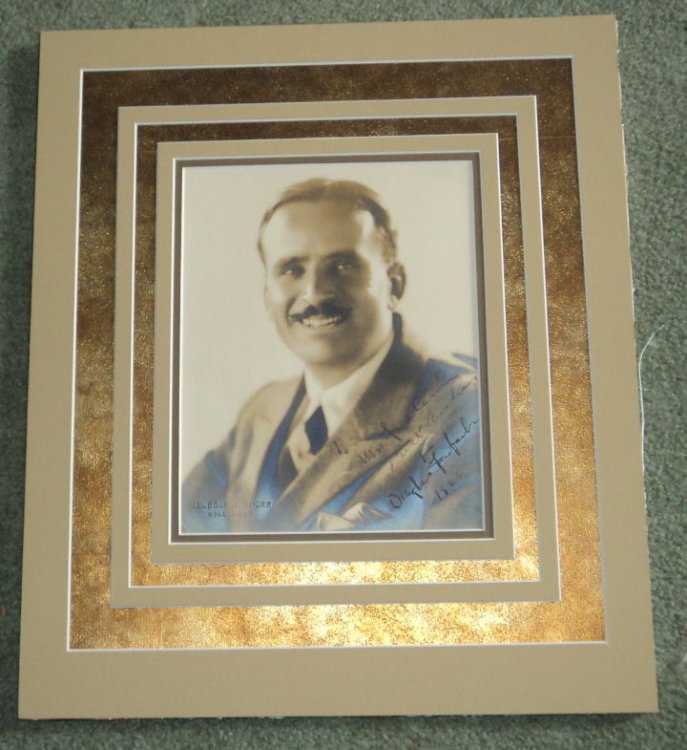 AN ORIGINAL PORTRAIT OF DOUGLAS FAIRBANKS BY MELBOURNE SPURR, INSCRIBED AND SIGNED BY FAIRBANKS IN 1926.