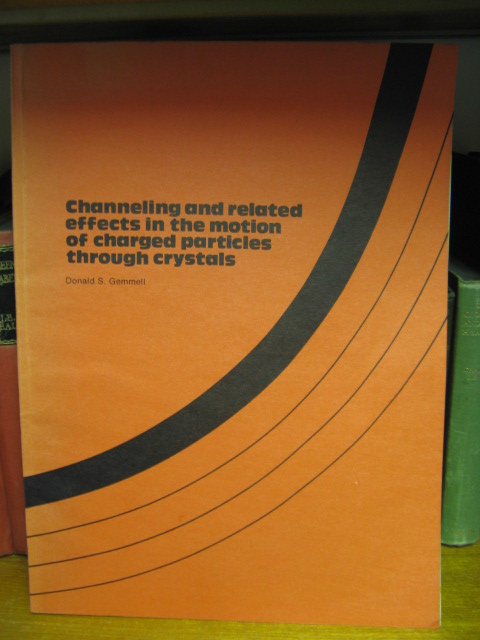 Channeling and Related Effects in the Motion of Charged Particles Through Crystals