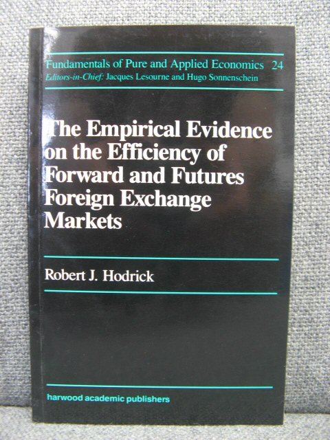 The Empirical Evidence on the Efficiency of Forward and Futures Foreign Exchange Markets