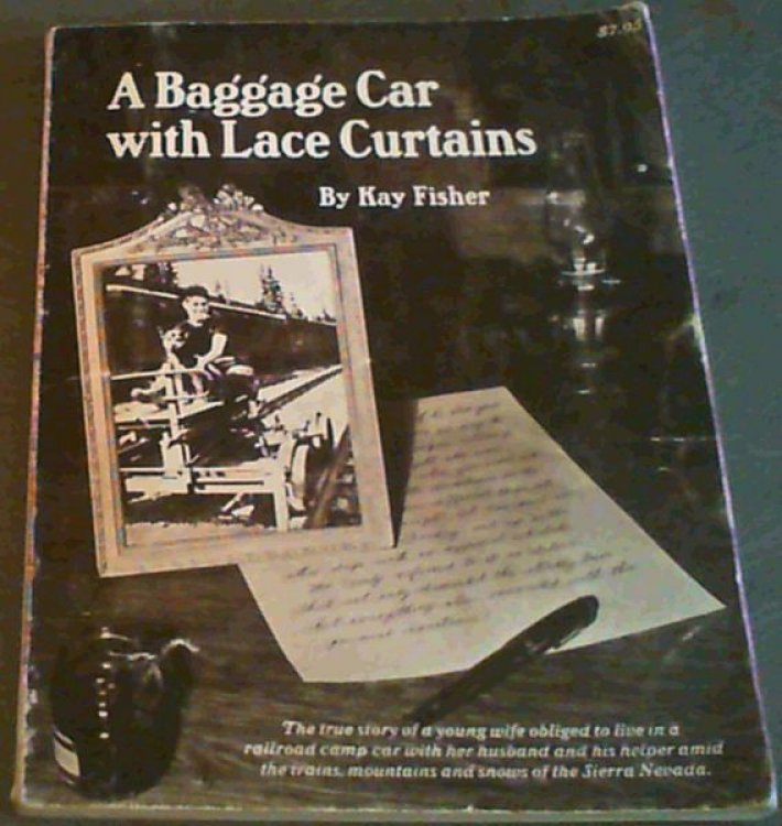A baggage car with lace curtains