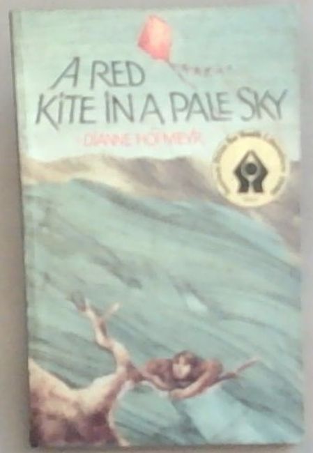 A red kite in a pale sky