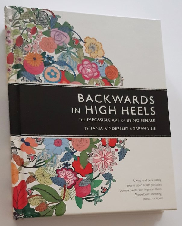 BACKWARDS IN HIGH HEELS: The Impossible Art of Being Female