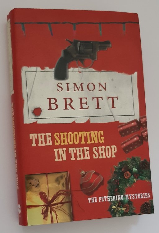 THE SHOOTING IN THE SHOP: A Fethering Mystery