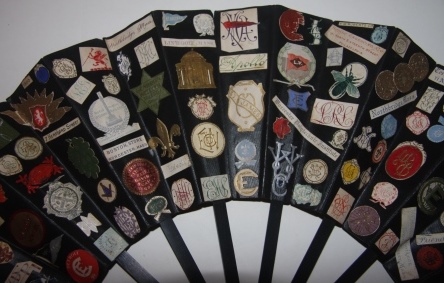 Fan with College and Preparatory School Names along with Place Names, Restaurant Names, Hotel Names, Monograms, Crests, Emblems, etc. Labels Pasted On