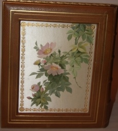 Photo Album with Sunken Inset Silk Panels with Chromolithographic Images of a Bluebird and Wild Roses (on front), and Just Roses on Back