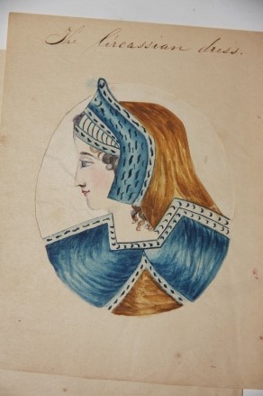 Manuscript metamorphic cut-out costume and headress overlays