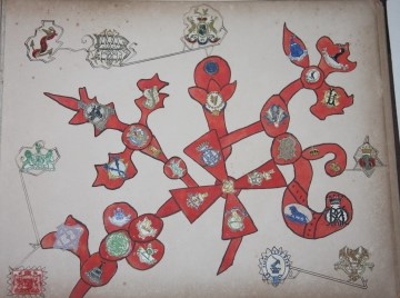 Whimsical Monogram and Crest Album, with monograms and crests incorporated into original watercolors and pen-and-ink artwork mostly mounted onto the page