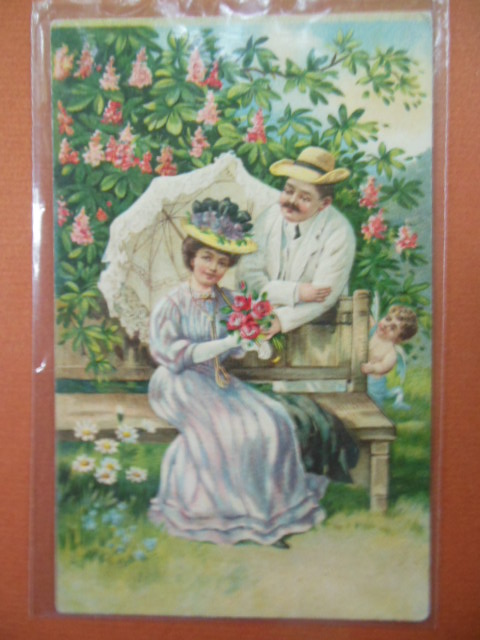 Couple in Garden Hiding Cupid Postcard