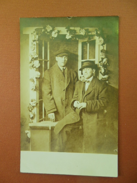 Real Photo Postcard Men in in Overcoats Posing Under Trellis