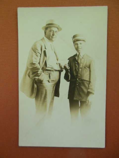 Real Photo Postcard Boy Dressed as Railroad Conductor Taking Man's Ticket, Pittsburg, PA