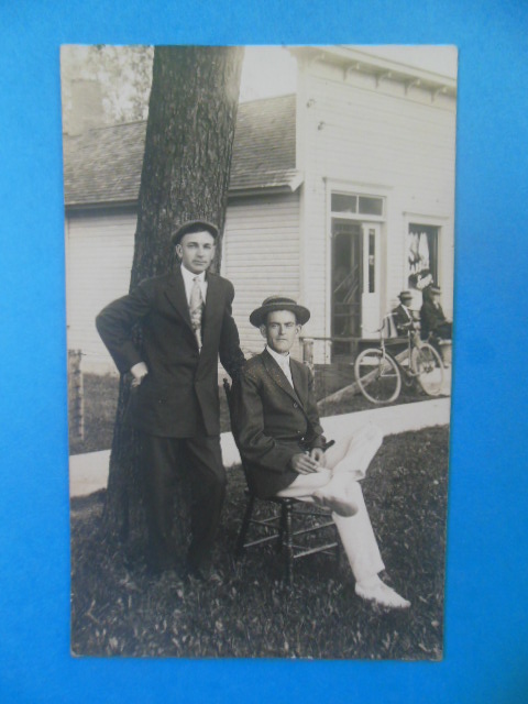 Real Photo Postcard Men and a Bike Waiting Outside the Barber Shop (1904-18)