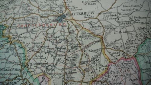 Bacon's New Survey Map of Dorsetshire [Dorset] showing railways, roads and distances, local government divisions & parishesm also golf links. Scale inch 1 mile