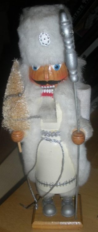 Russian white wooden nutcracker soldier