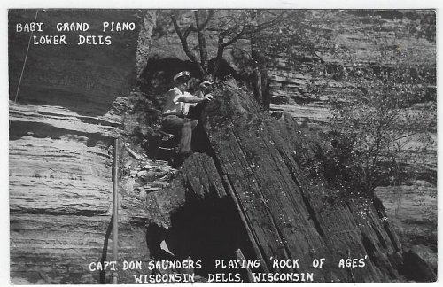 REAL PHOTO POSTCARD OF BABY GRAND PIANO, LOWER DELLS WISCONSIN DELLS, WISCONSIN