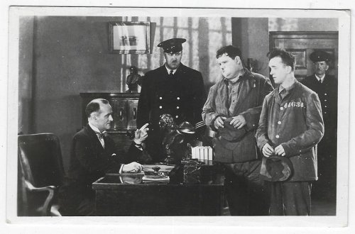 MOVIE STILL POSTCARD OF LAUREL AND HARDY IN PARDON US