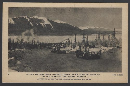 TRUCKS ROLLING DOWN TOWARD DONJEK RIVER CARRYING SUPPLIES TO THE CAMPS ON THE ALASKA HIGHWAY