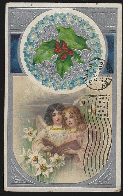CHRISTMAS GREETINGS POSTCARD WITH ANGELS SINGING BLUE FLORAL WREATH AND HOLLY