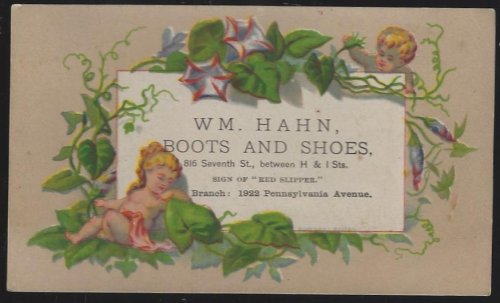 VICTORIAN TRADE CARD FOR WM. HAHN, BOOTS AND SHOES WITH CHERUBS AND VINE AND FLOWERS