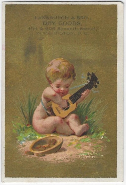 VICTORIAN TRADE CARD FOR LANSBURGH AND BRO DRY GOODS WITH BOY PLAYING GUITAR