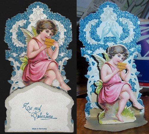 VICTORIAN FOLD OUT VALENTINE WITH LITTLE BOY PLAYING THE PAN FLUTE