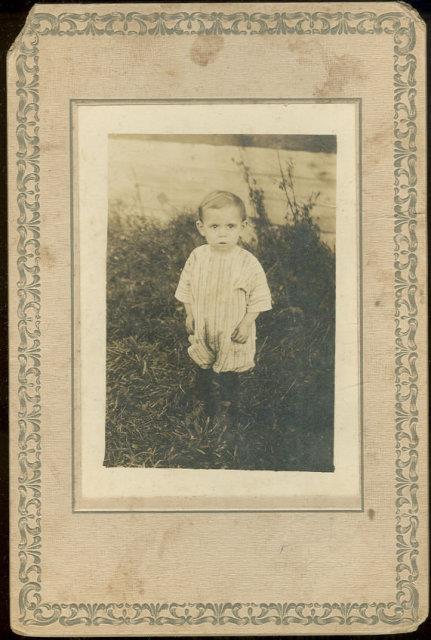 YOUNG BOY IN PLAY ROMPER