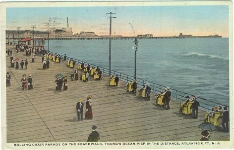ROLLING CHAIR PARADE ON THE BOARDWALK, ATLANTIC CITY, NEW JERSEY