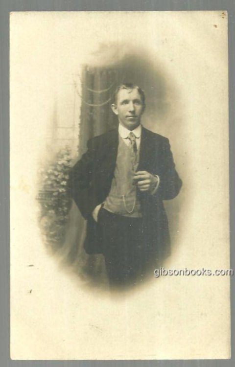 REAL PHOTO POSTCARD OF YOUNG MAN IN SUIT