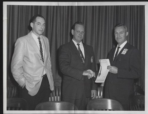 ORIGINAL PHOTOGRAPH OF PRESENTATION WITH THREE MEN, MARSHALL SPACE FLIGHT CENTER