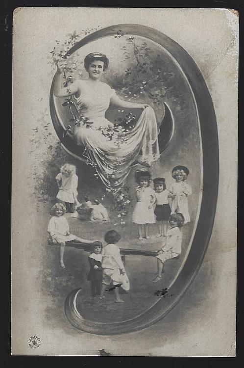 POSTCARD OF LOVELY LADY SITTING IN ON INITIAL J SURROUNDED BY CHILDREN PLAYING
