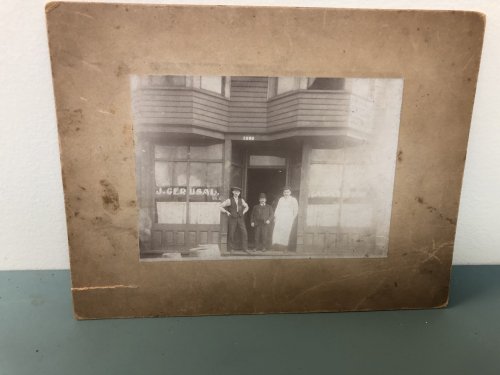 Three Men at Store Front , J. Gerusal