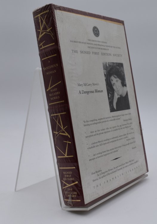 A DANGEROUS WOMAN - [signed]